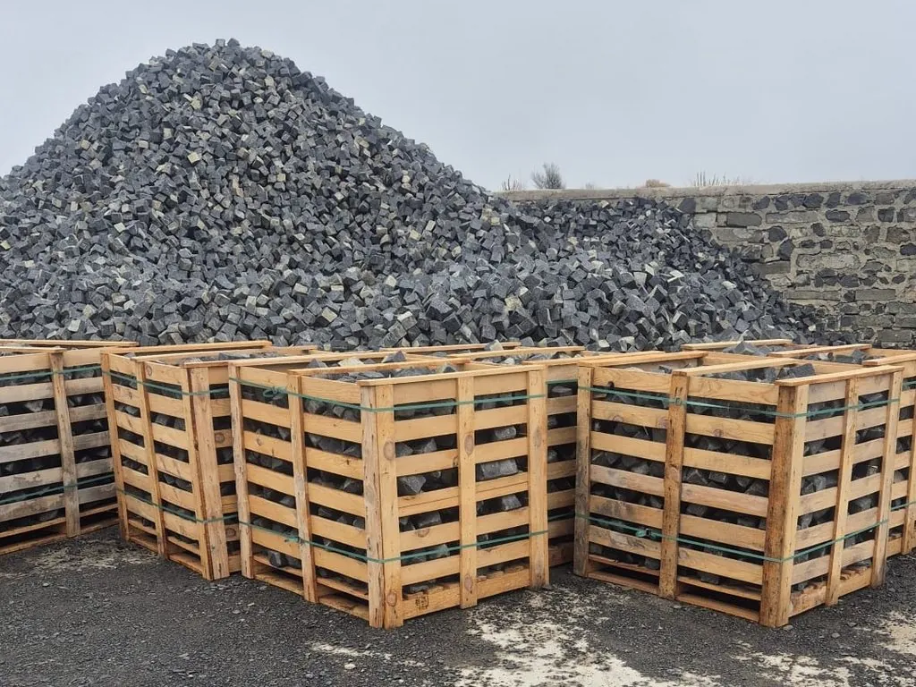 Basalt setts packed in timber crates at the quarry, ready for loading