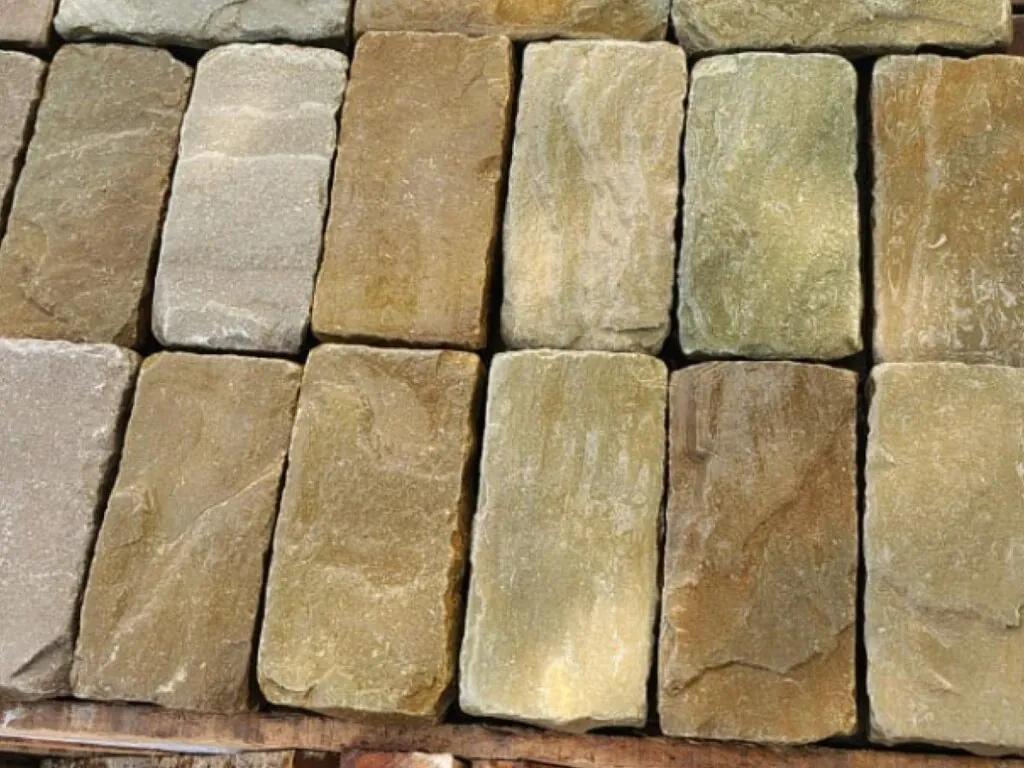 Sandstone walling blocks showing the natural buff, brown and grey tonal range